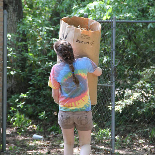 woman doing ministry work, carrying large bag